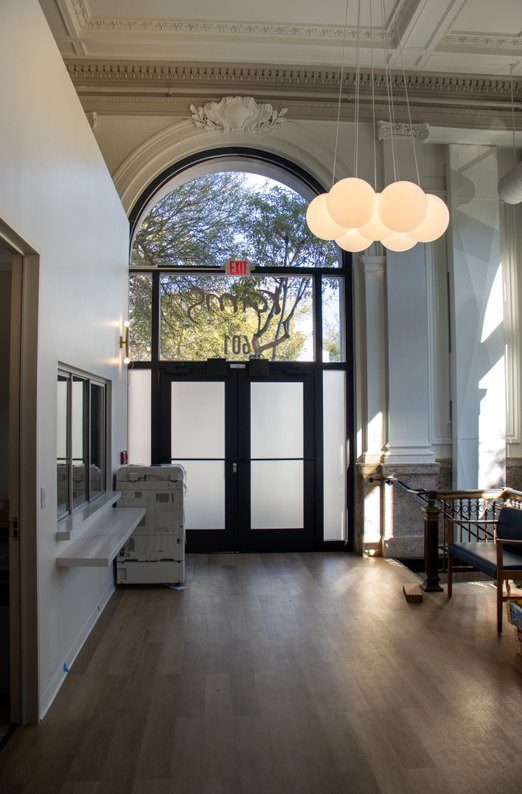 Arched window and frosted-glass entry at Clement St