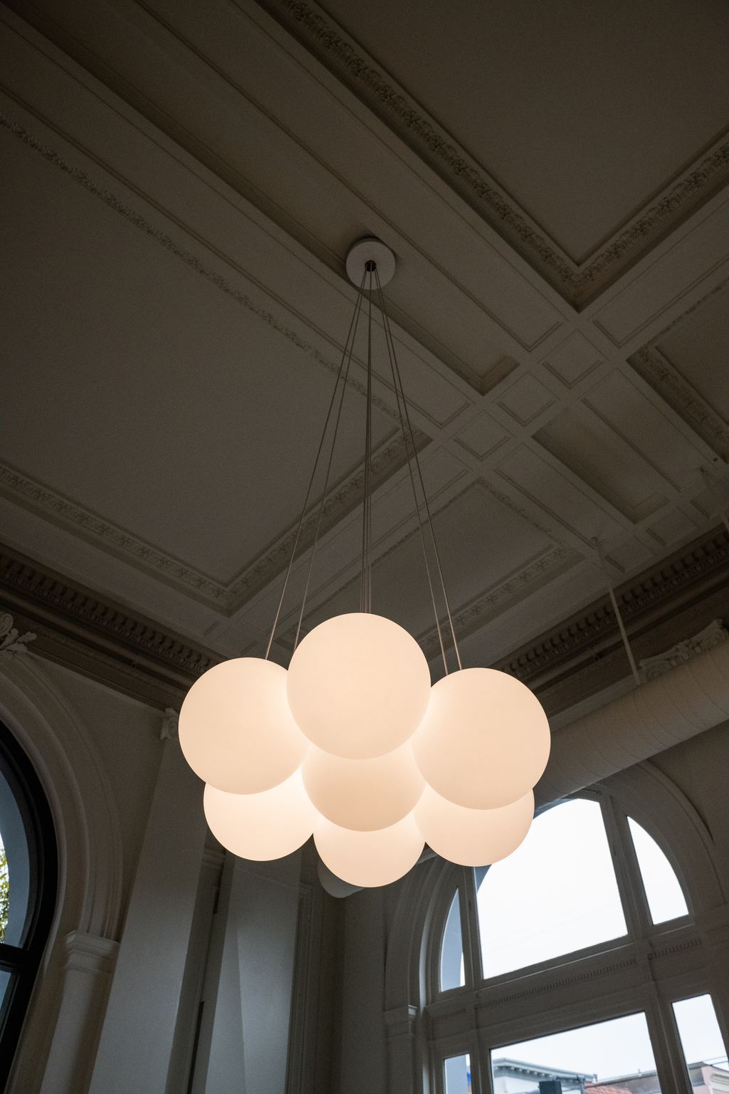 Coffered plaster ceiling with a new globe pendant cluster, San Francisco