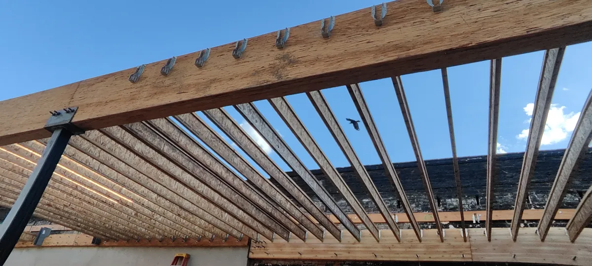 New roof joists framed on steel, before sheathing, Bluxome St