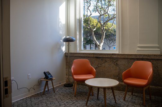 Seating nook with stone wainscot at Clement St